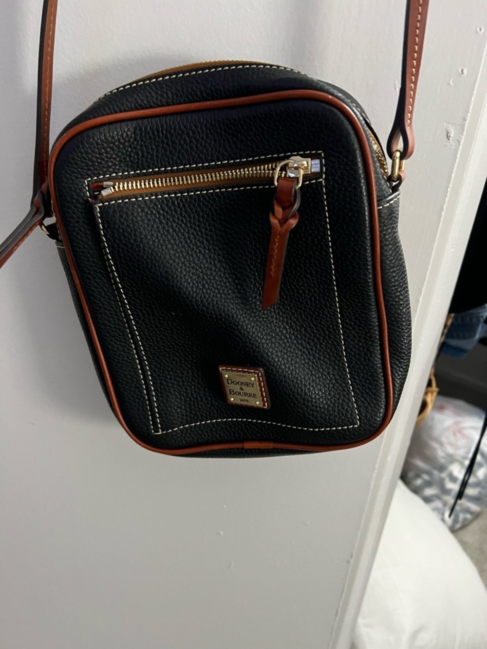 Dooney & Bourke Black Pebbled Leather Crossbody with Orange Trim and Red Lining